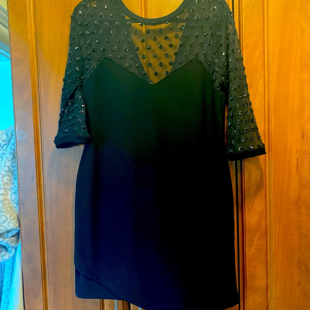Top shop black sequinned mini dress. Long sheer sleeves with polka dots.
